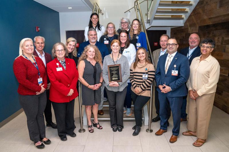 Reduction of Inpatient and Emergency Department Patient Falls award presentation attendees shown are in back (l-r) Teri Wilkinson, director of emergency services, and Susan Mross, emergency room nurse manager; third row, nurse managers Jen Mancuso and Tiffany Travis; second row, Mike Meoli; Mary McLoughlin; Eric Sweitzer, quality manager; Jamie Dickerson; Dr. Paul C. Peet; and Matt Lukasiak. In front are Dawn Snyder, clinical professional development manager; Sara Larch; Amy Linzey, nursing informatics; Dareth Penuel, MSN, RN, nurse manager; Logan Vitolo, niche coordinator; Dr. Paul Sierzenski; and Bonnie Hall.